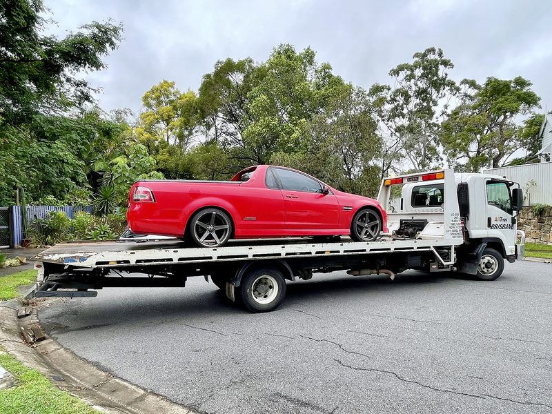 Tilt tray truck carrying a ute in Queensland, Australia